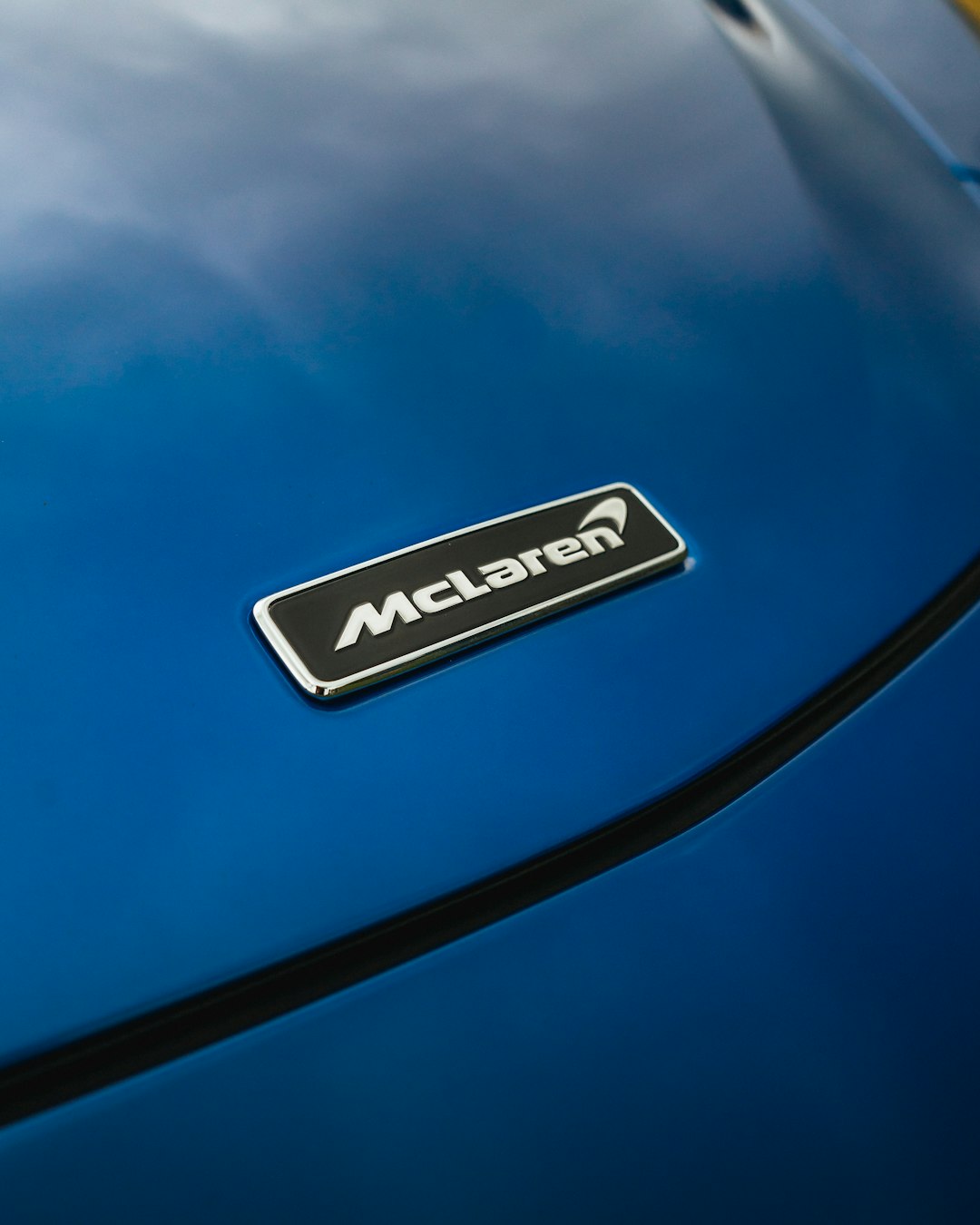 a-close-up-of-the-emblem-on-a-blue-sports-car-isgknfr5klg